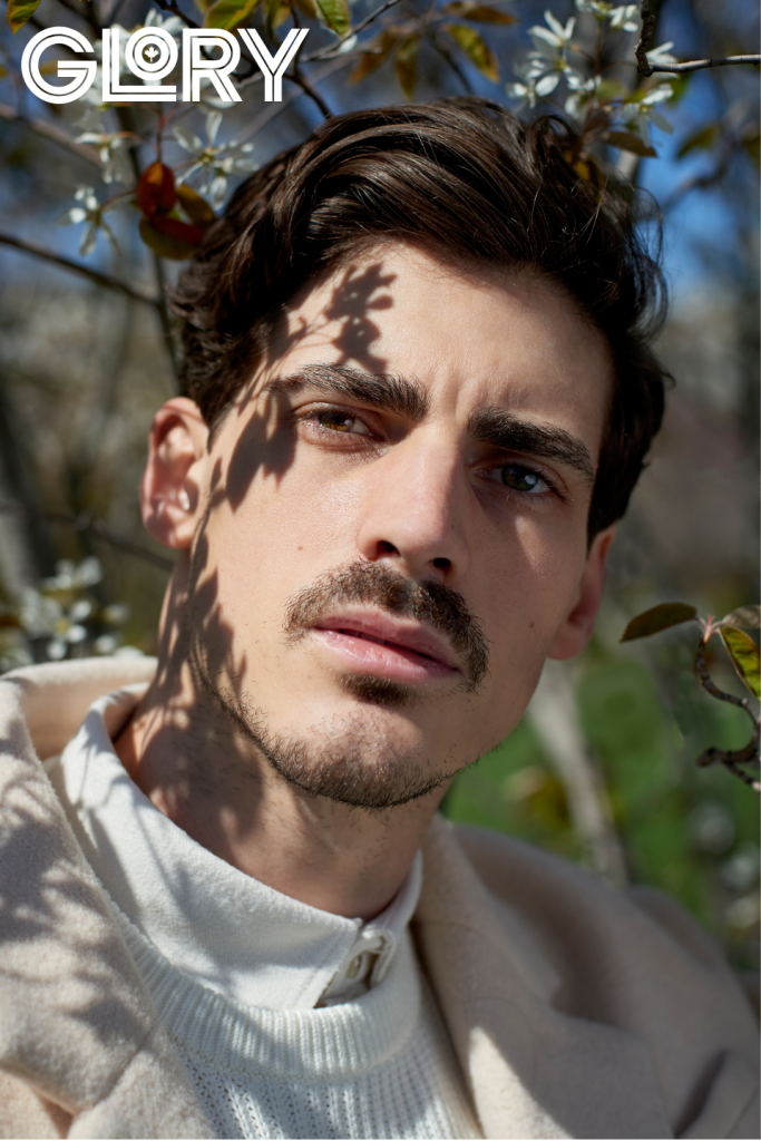 Paul Poirier in white under tree