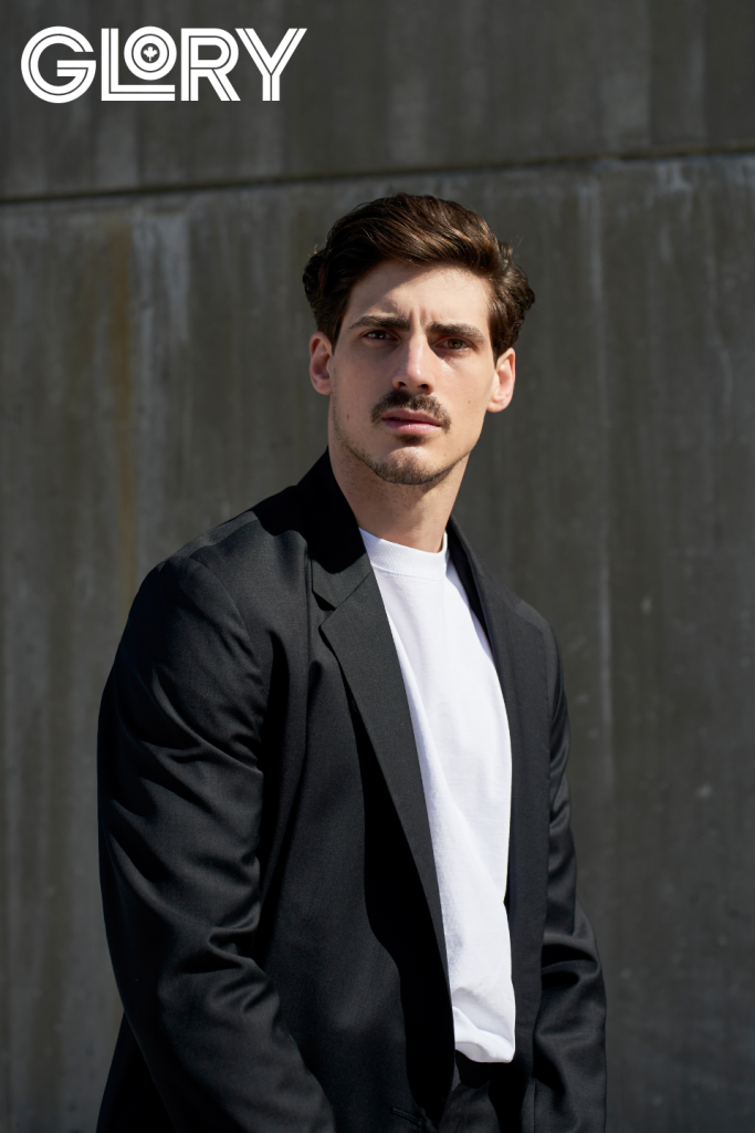 Paul Poirier in black jacket and white tee