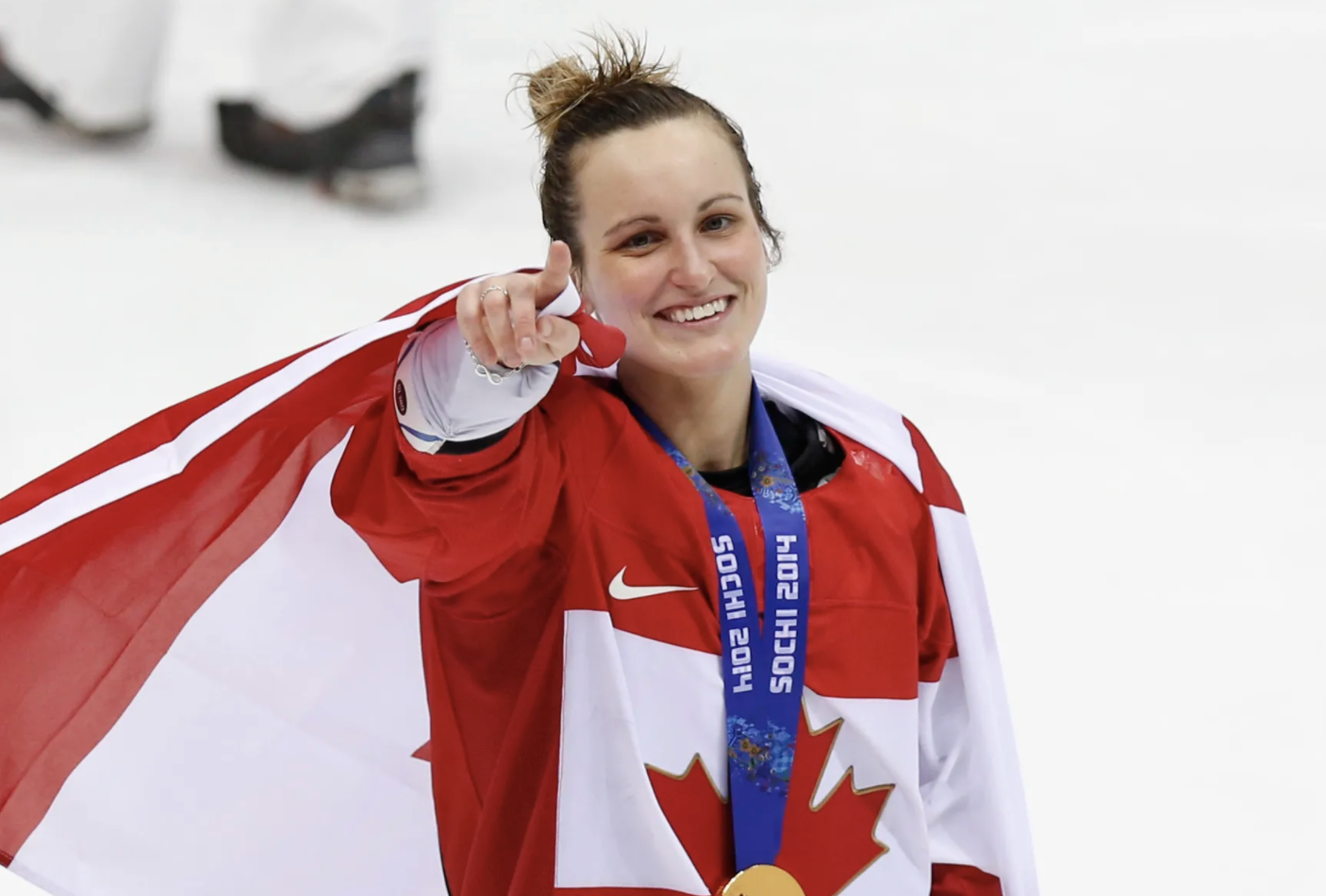 Marie-Phillip Poulin holding Canadian flag